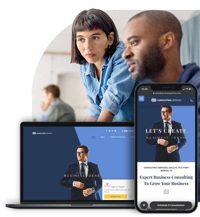 Two coworkers collaborating in an office, shown alongside a laptop and mobile phone featuring a professional consulting website design.