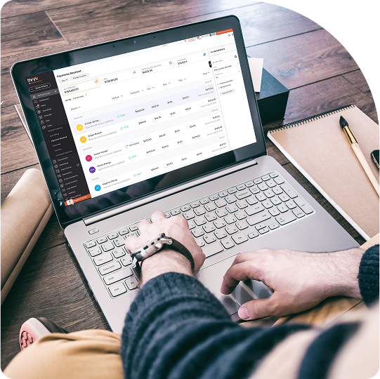 Person using a laptop displaying Thryv dashboard with expense tracking and financial management tools.