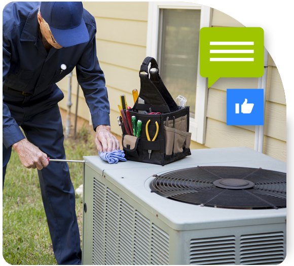 A male HVAC technician fixing an outdoor AC unit  with his toolkit
