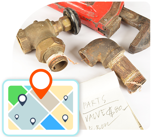 Plumbing parts and a wrench with an illustration of a map in the foreground