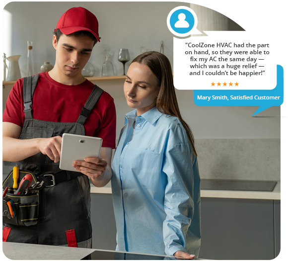 A male HVAC technician showing a price breakdown on a tablet to a female customer
