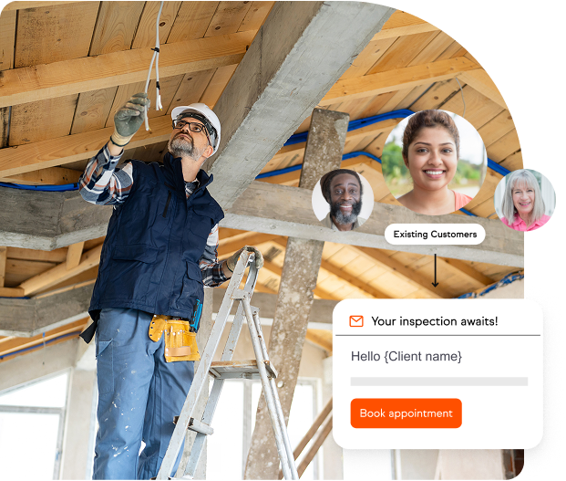 Male electrician on a ladder fixing wires on the inside of a roof