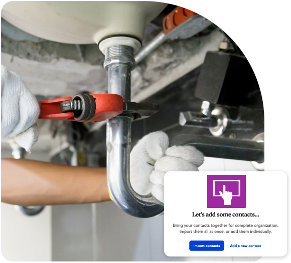 Wrench wrapped around a pipe under a sink for a plumbing business repair