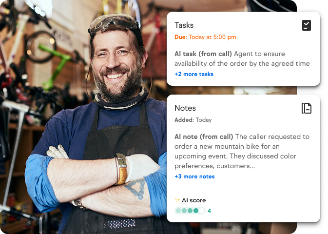 Mechanic with arms crossed smiling with tasks reminders in front of him
