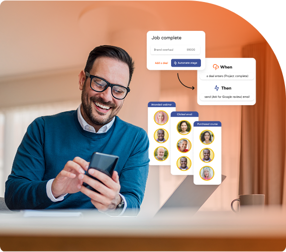 A contract worker looking at his phone smiling