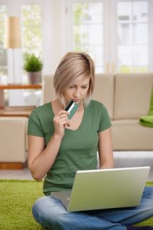 woman with a laptop and credit card
