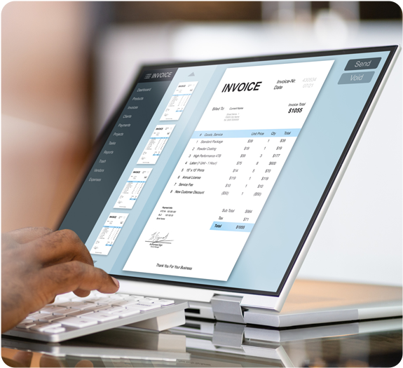 Desktop computer displaying a preview of a digital invoice using a free invoice generator tool